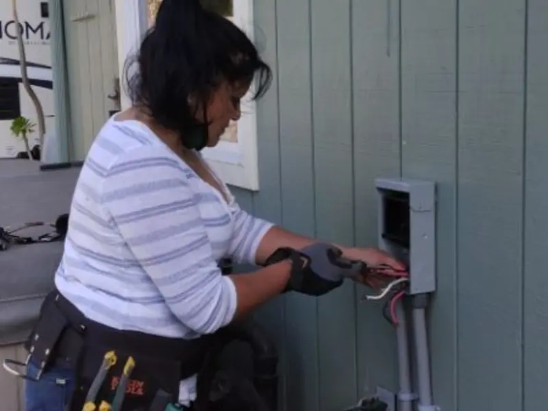 Licensed electrician wiring an exterior subpanel in Milpitas